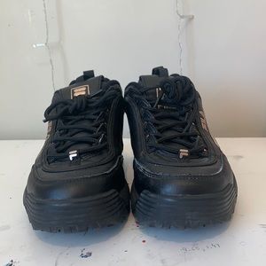 Black and rose gold woman’s FILA disruptors size 8